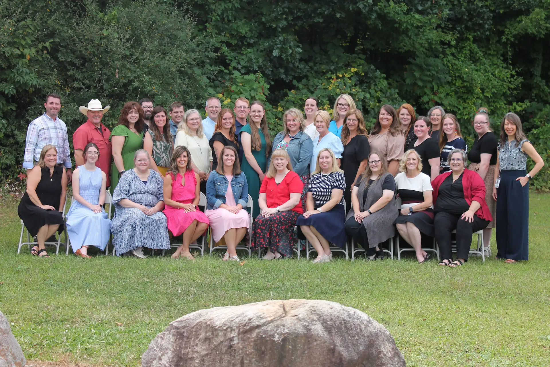 Heritage Christian Academy teachers and staff gathered outdoors for a group photograph